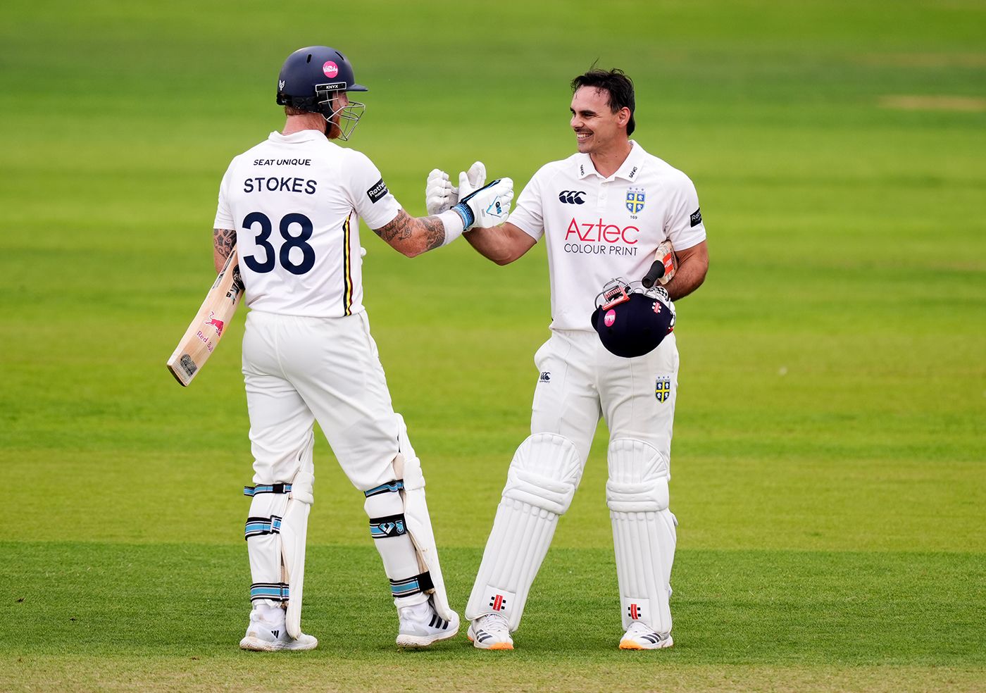 David Bedingham gets a handshake from Ben Stokes on completing his hundred
