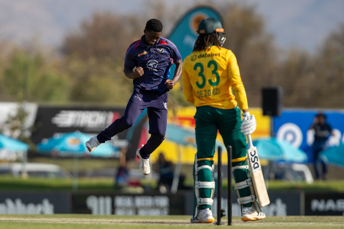 Max Heingo celebrates after knocking Tony de Zorzi over