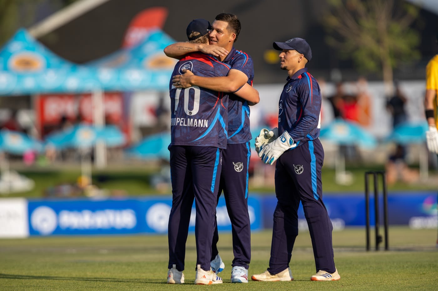 JJ Smit gets a bear hug from Ruben Trumpelmann
