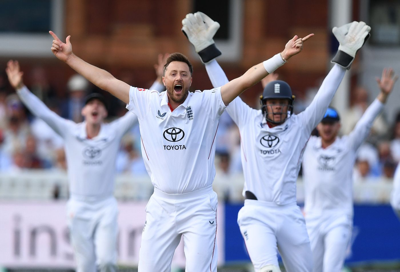 Ollie Robinson and England appeal in unison for Azan Awais's wicket