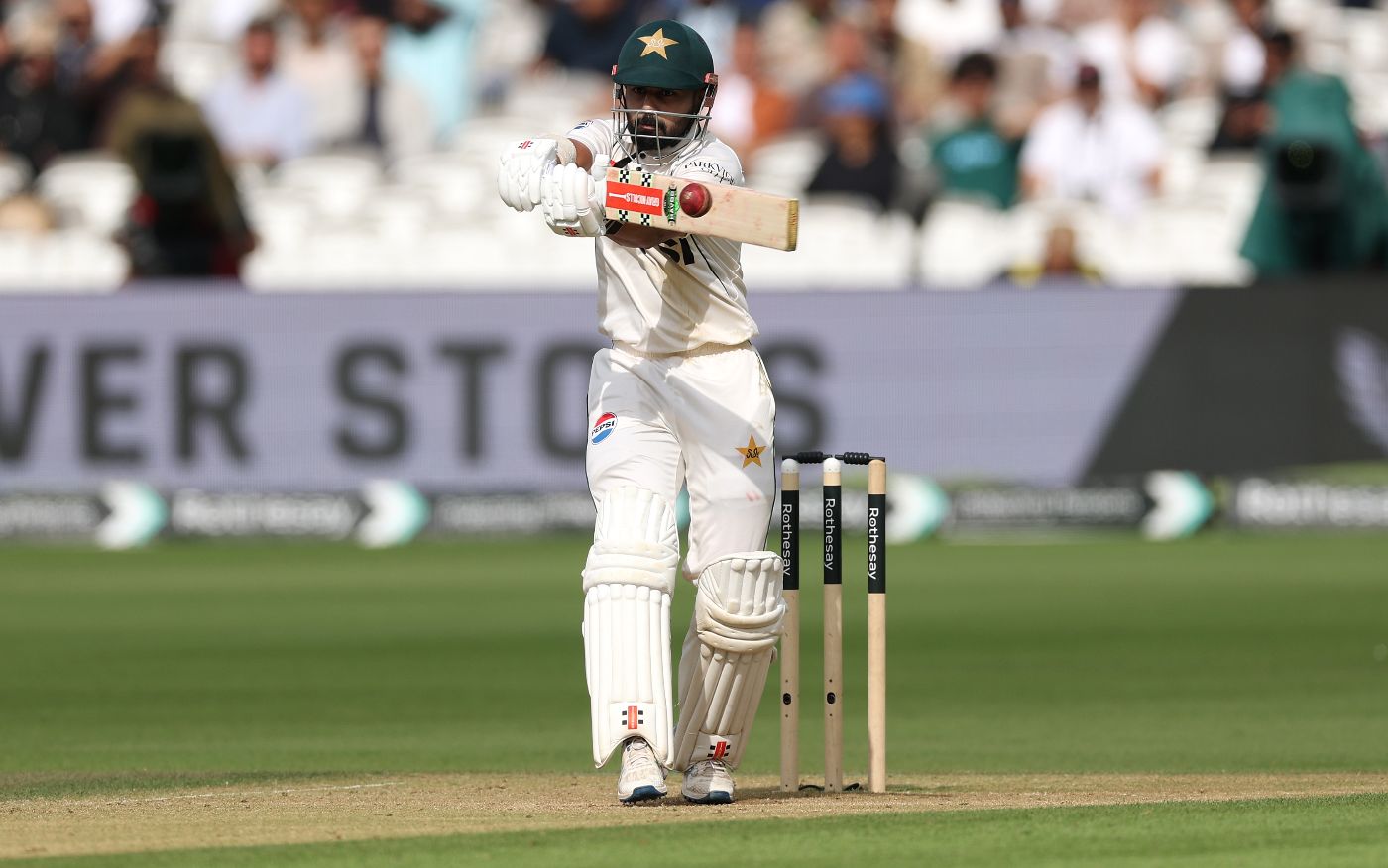 Saud Shakeel climbs into a pull shot