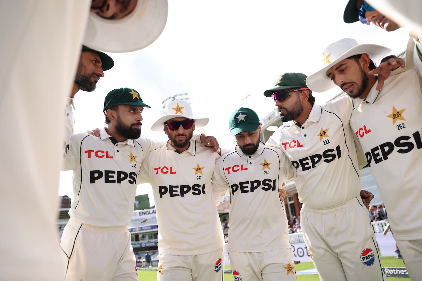 Babar Azam gets his team in a huddle