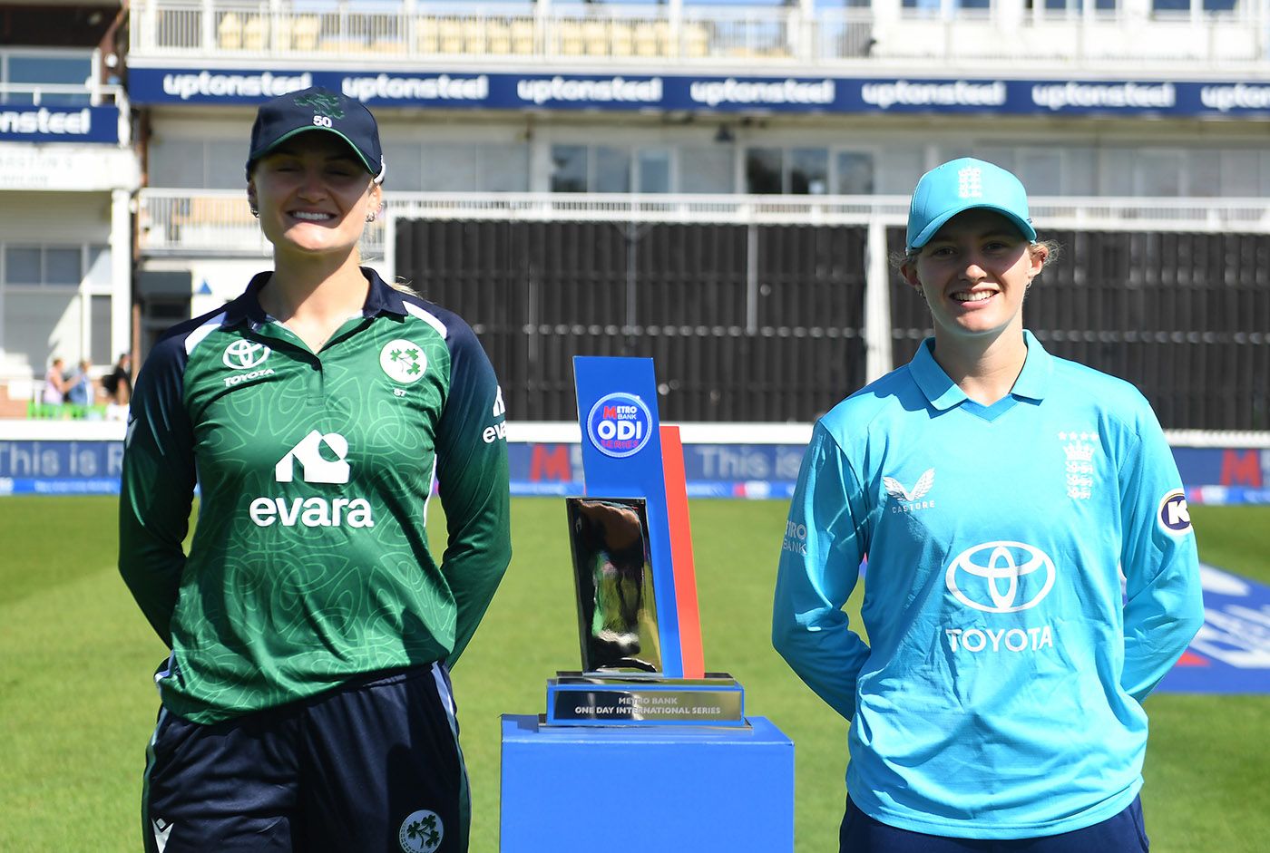 Gaby Lewis and Charlie Dean pose with the series trophy