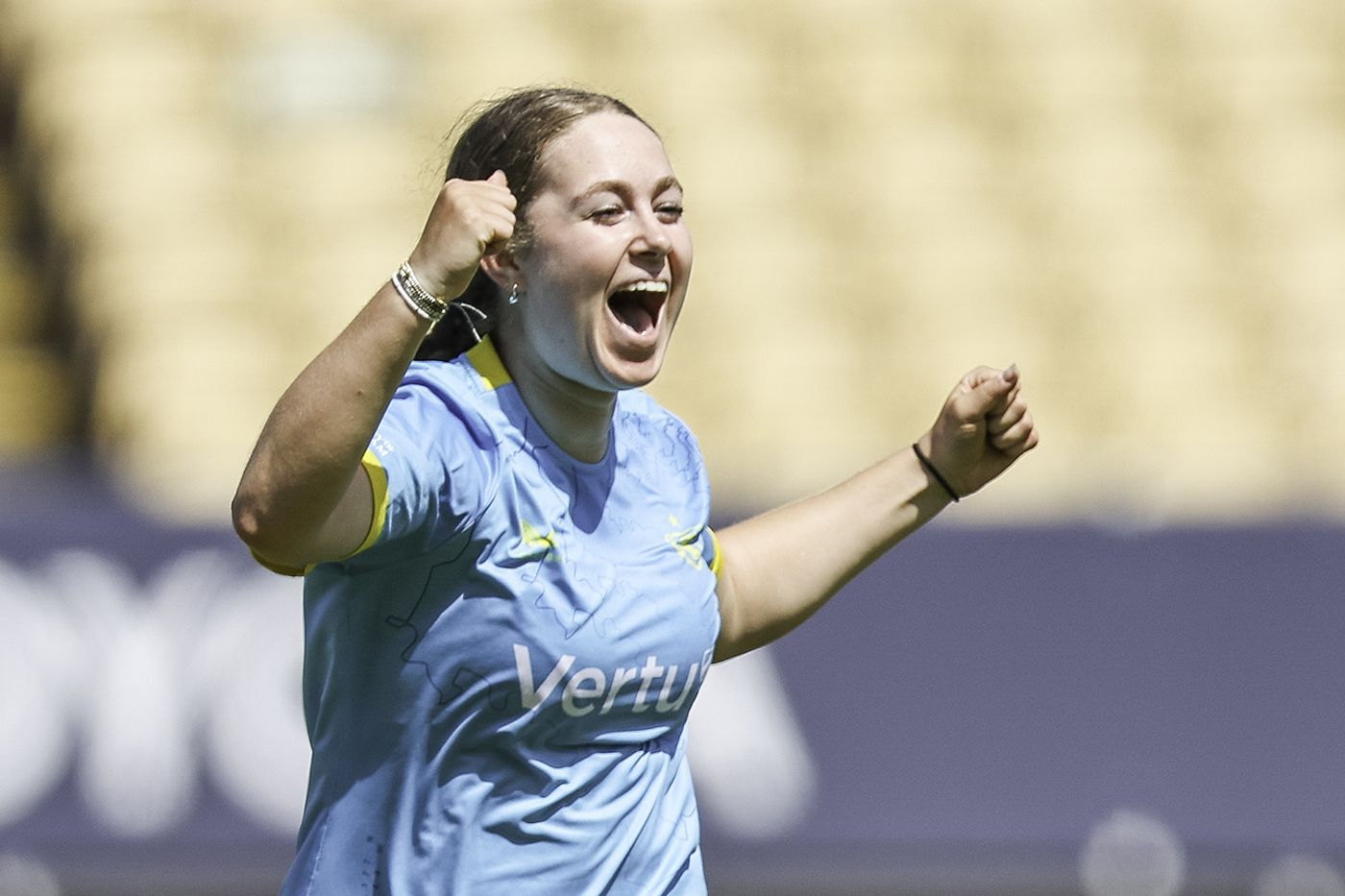 Phoebe Brett celebrates a wicket