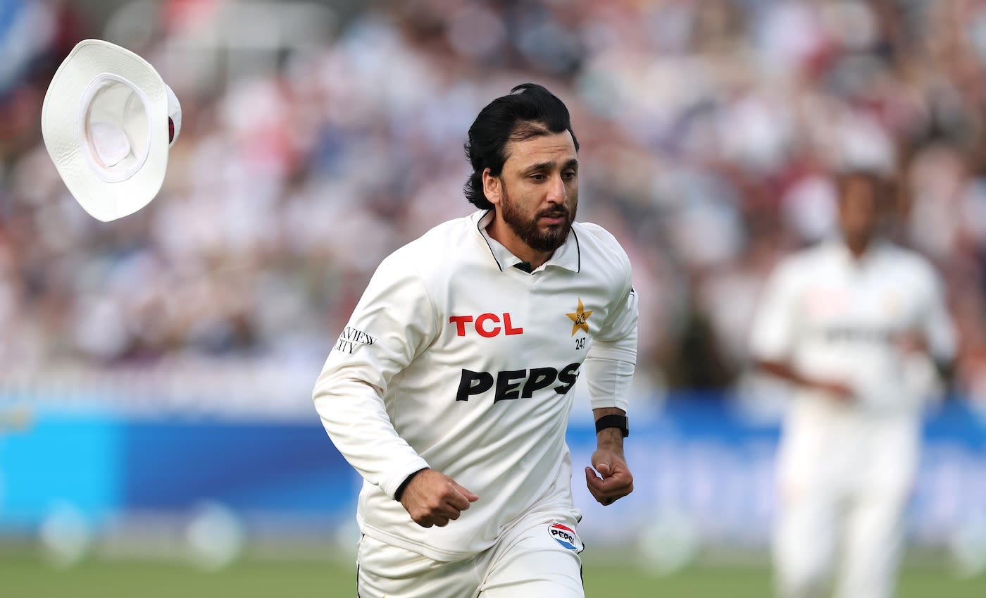 Salman Gha loses his hat as he races after the ball