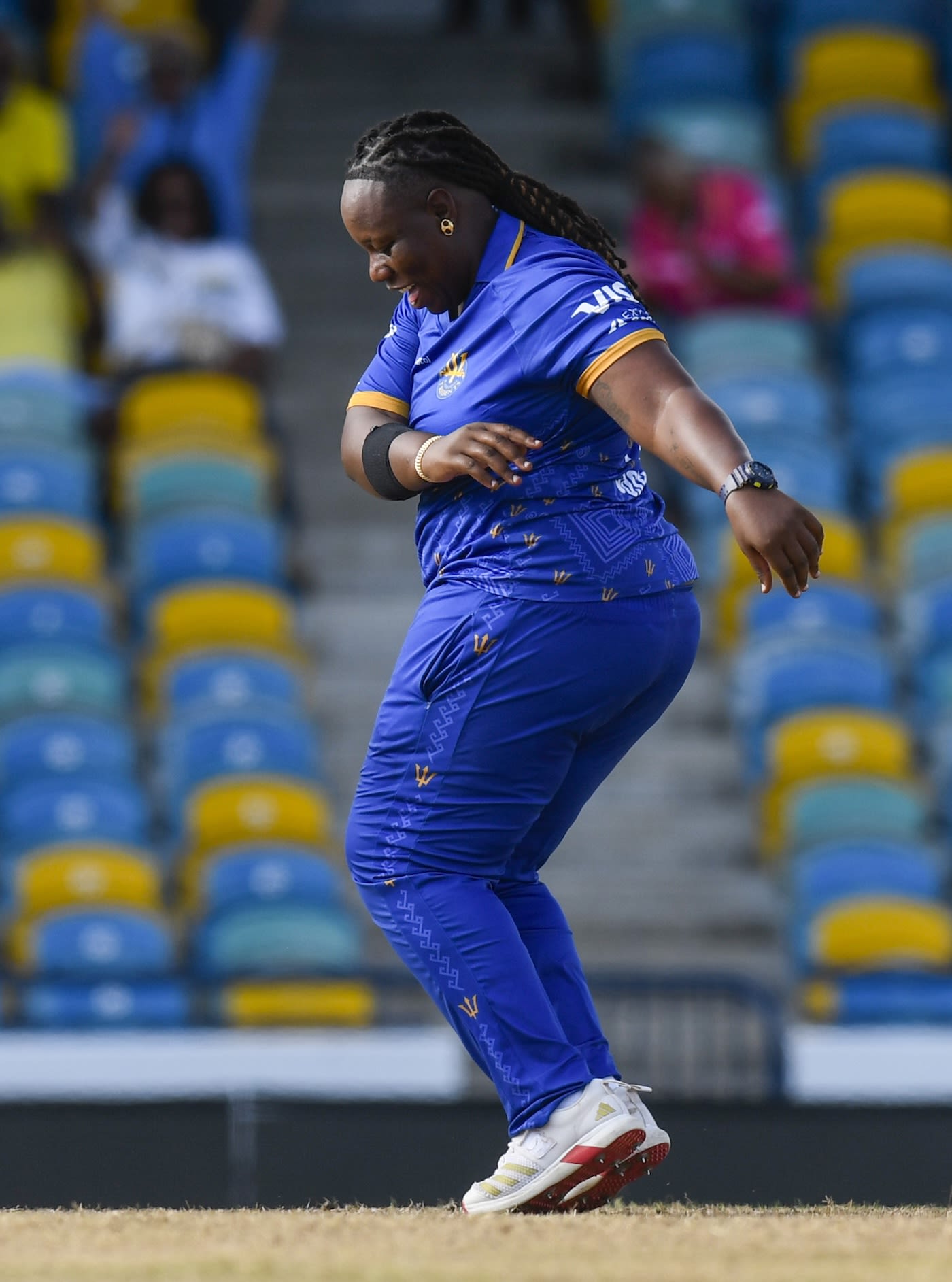 Qiana Joseph does a jig after picking up a wicket