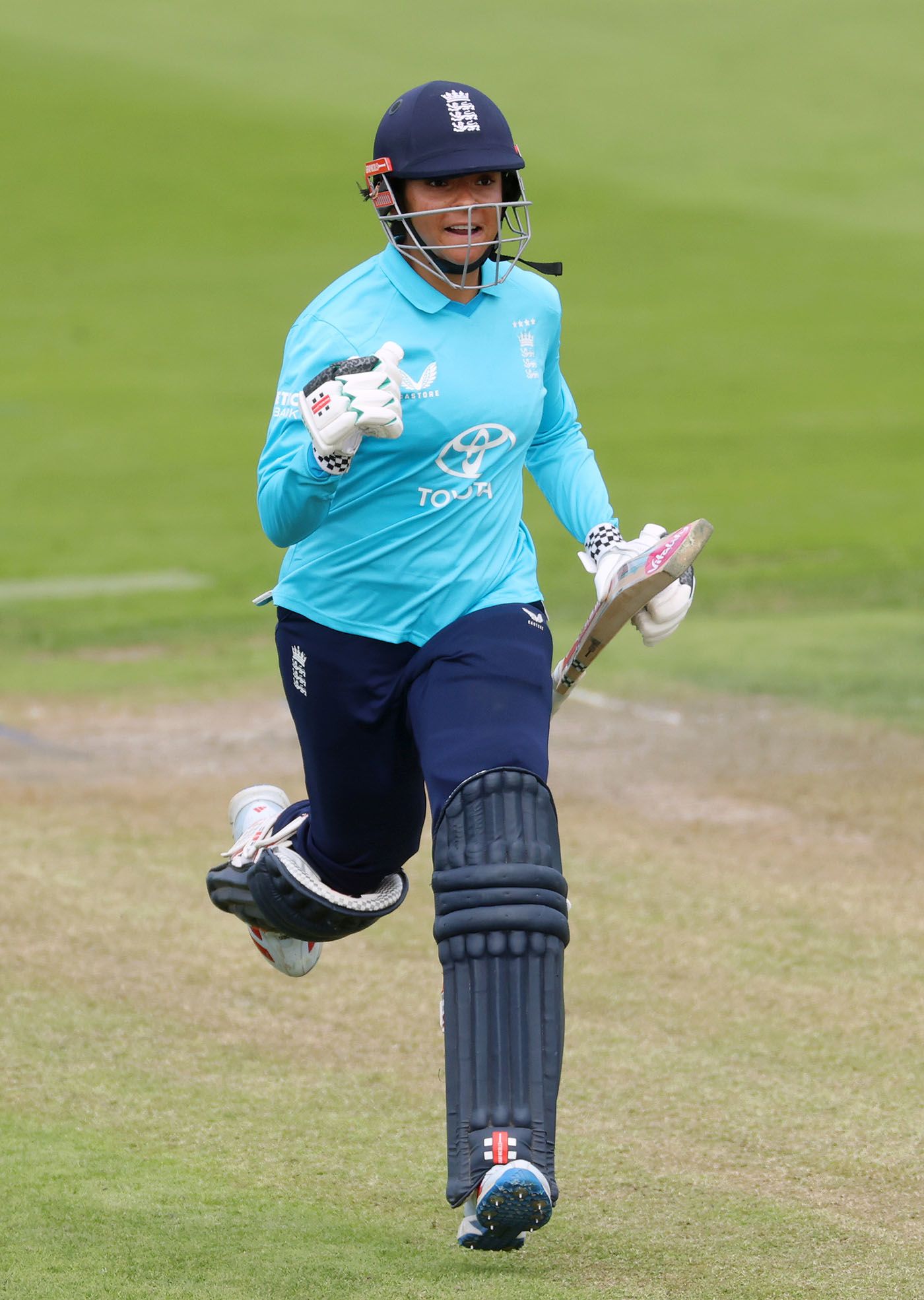 Sophia Dunkley runs through to complete her hundred