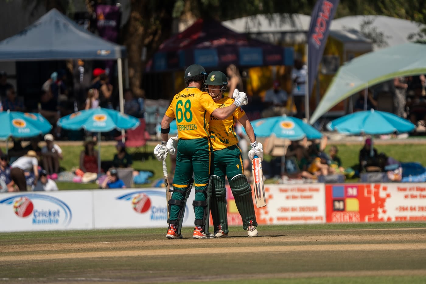 Jordan Hermann celebrates his fifty with Connor Esterhuizen