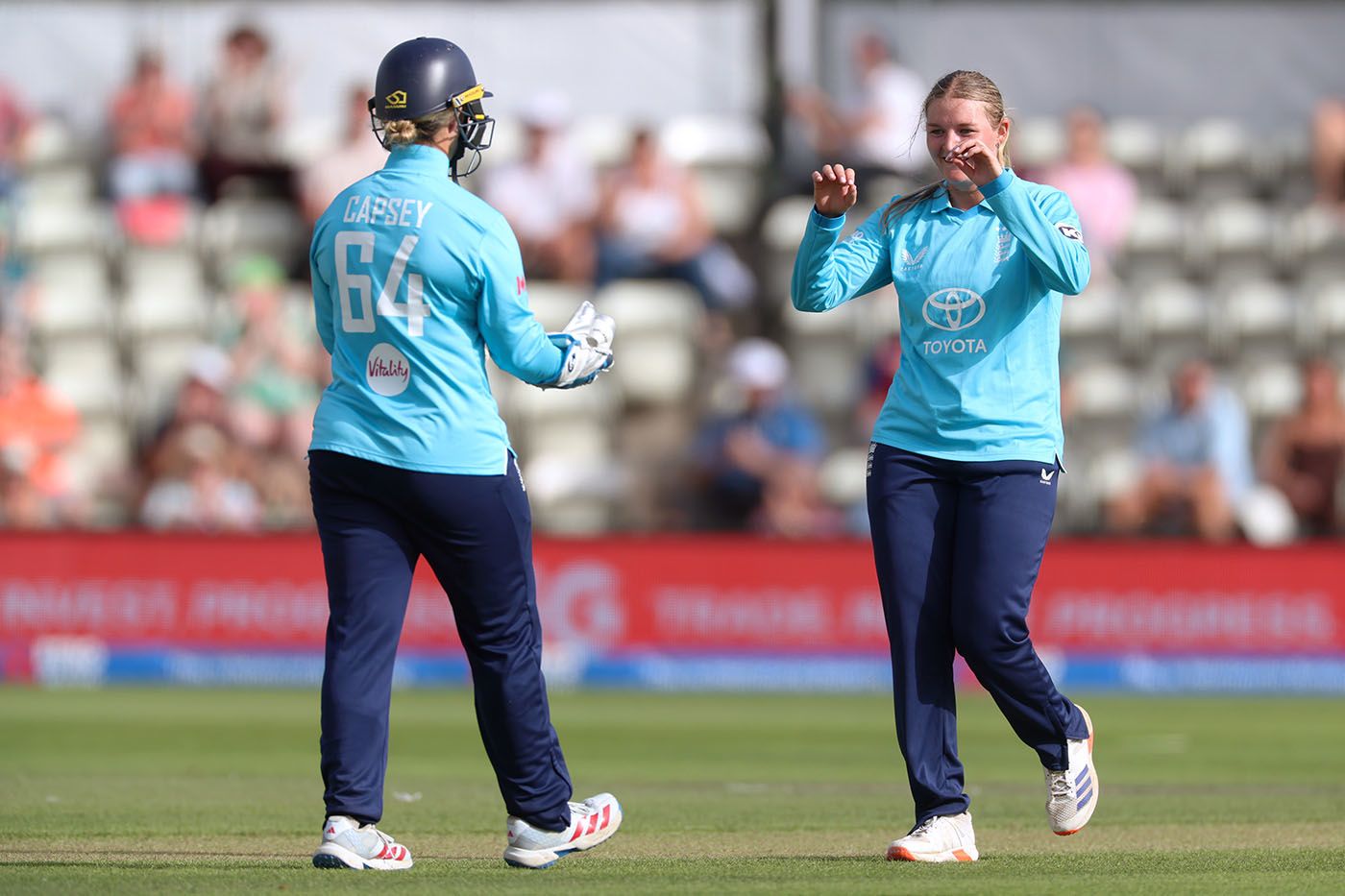 Alice Capsey celebrates a stumping with Ryana MacDonald-Gay