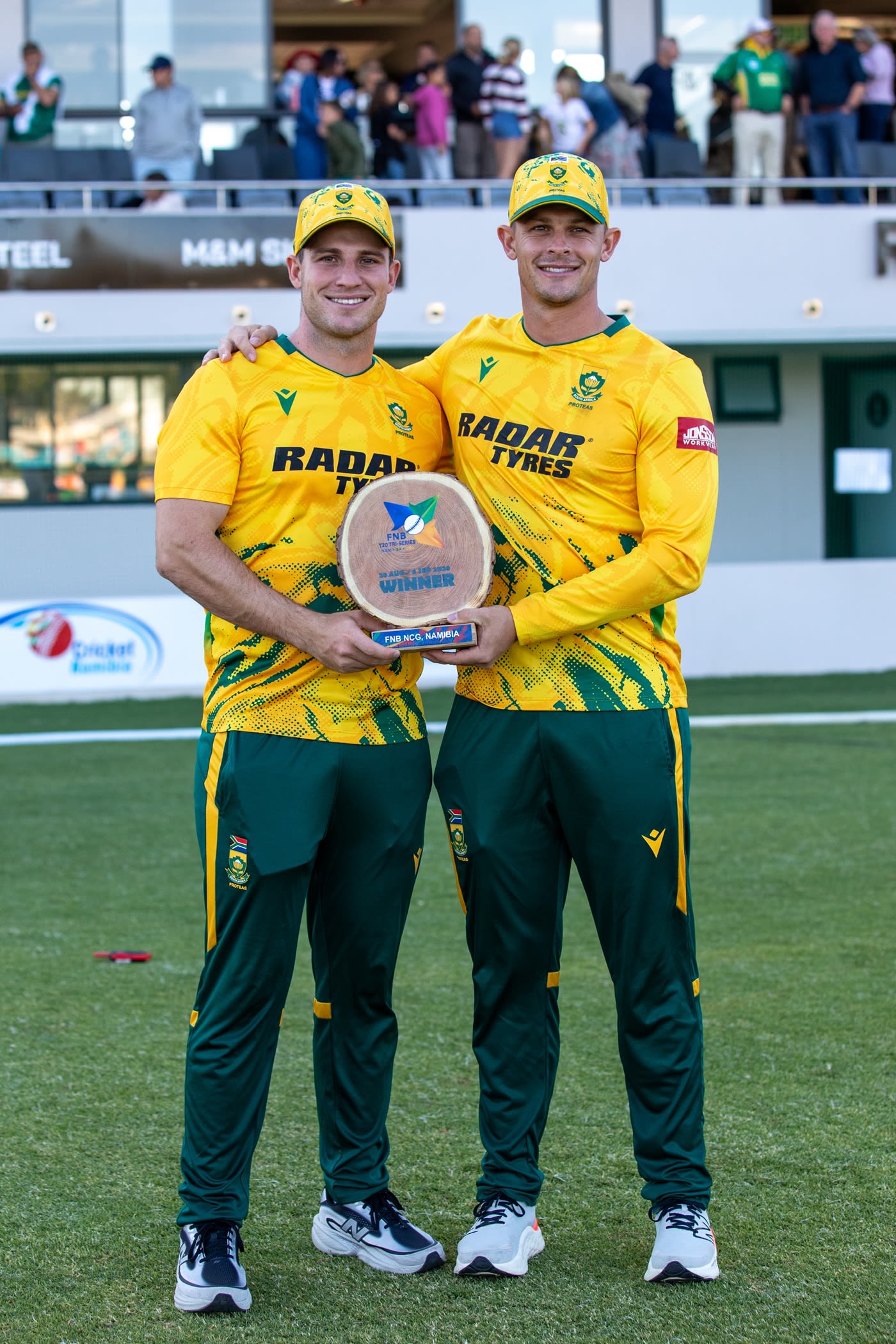 Jordan and Rubin Hermann pose with the series trophy