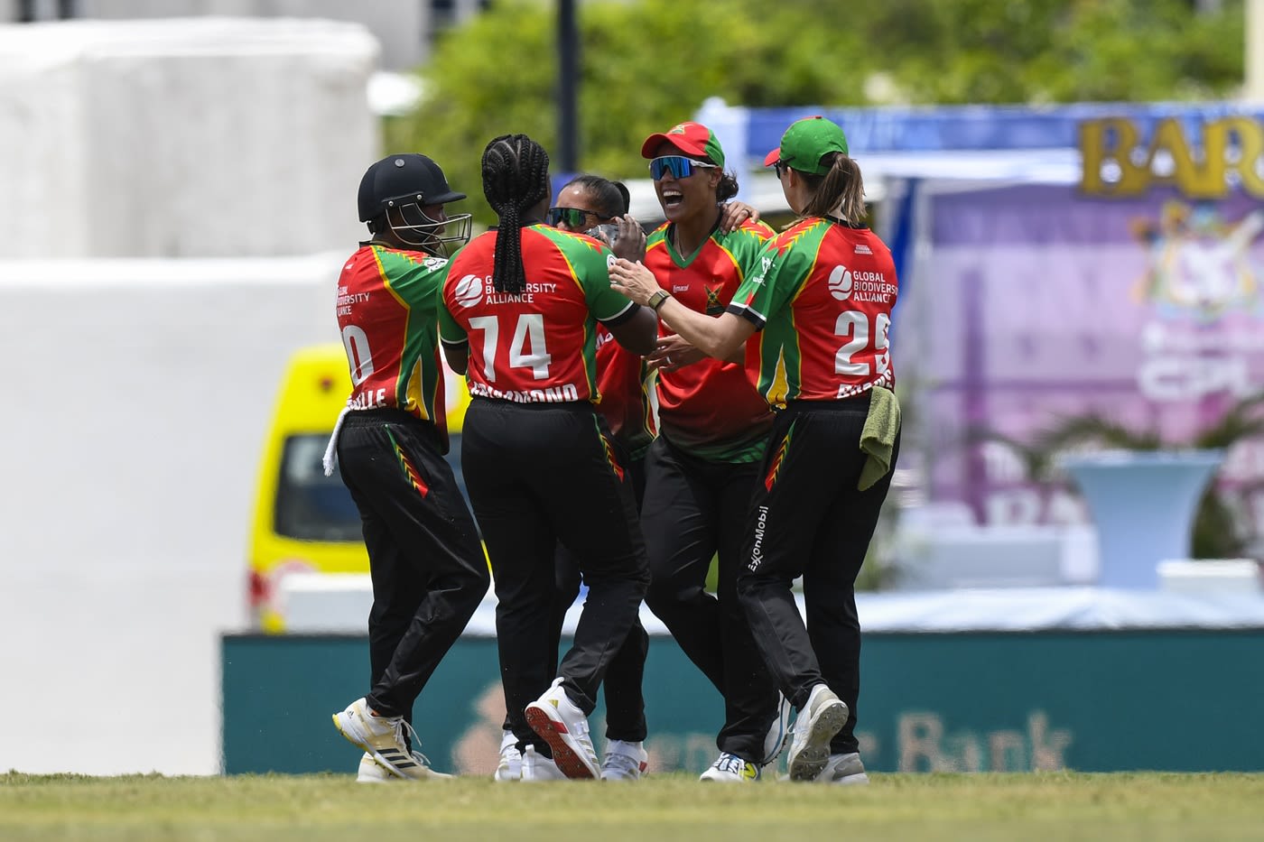 Chloe Tryon celebrates a wicket with her team-mates