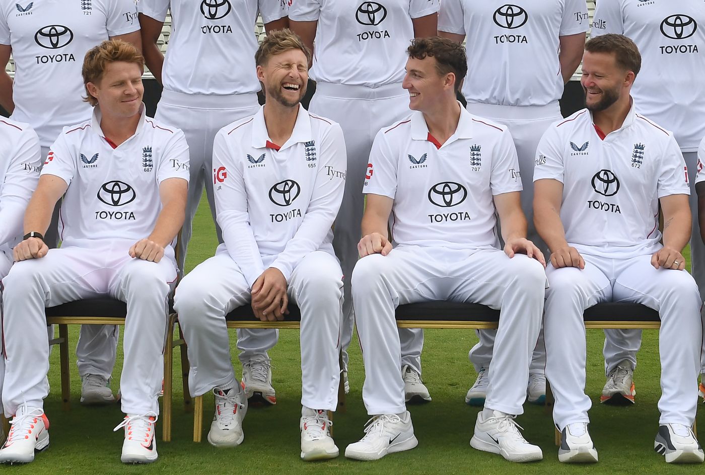 Joe Root shares a joke with his England team-mates during their photocall