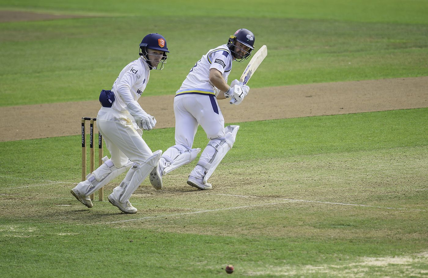 Adam Lyth tucks off his pads during his half-century