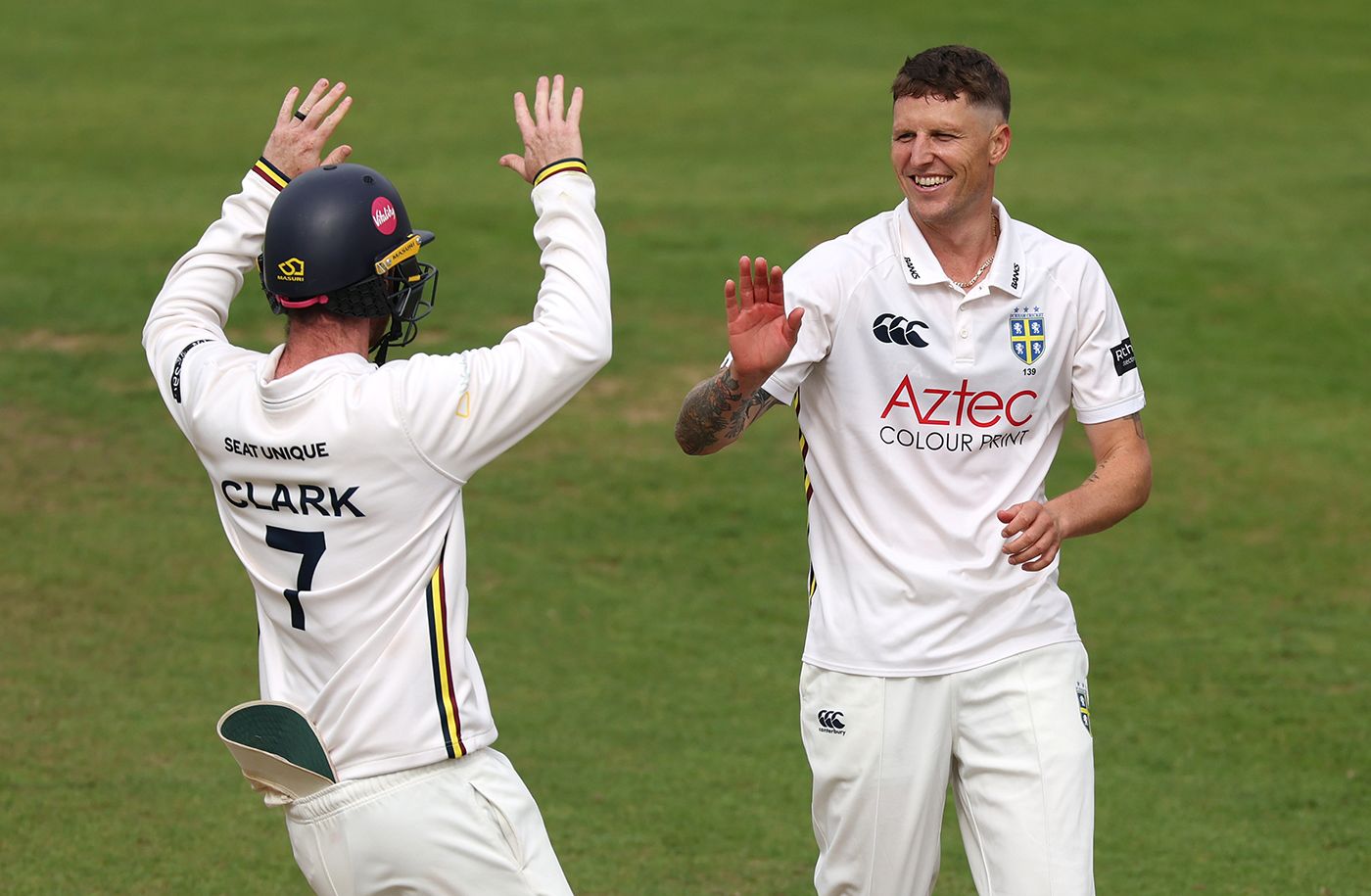 Brydon Carse celebrates his fifth wicket