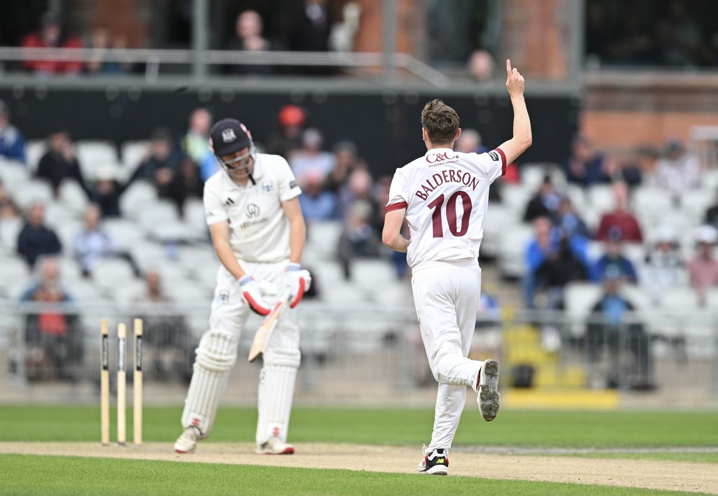 George Balderson celebrates a wicket
