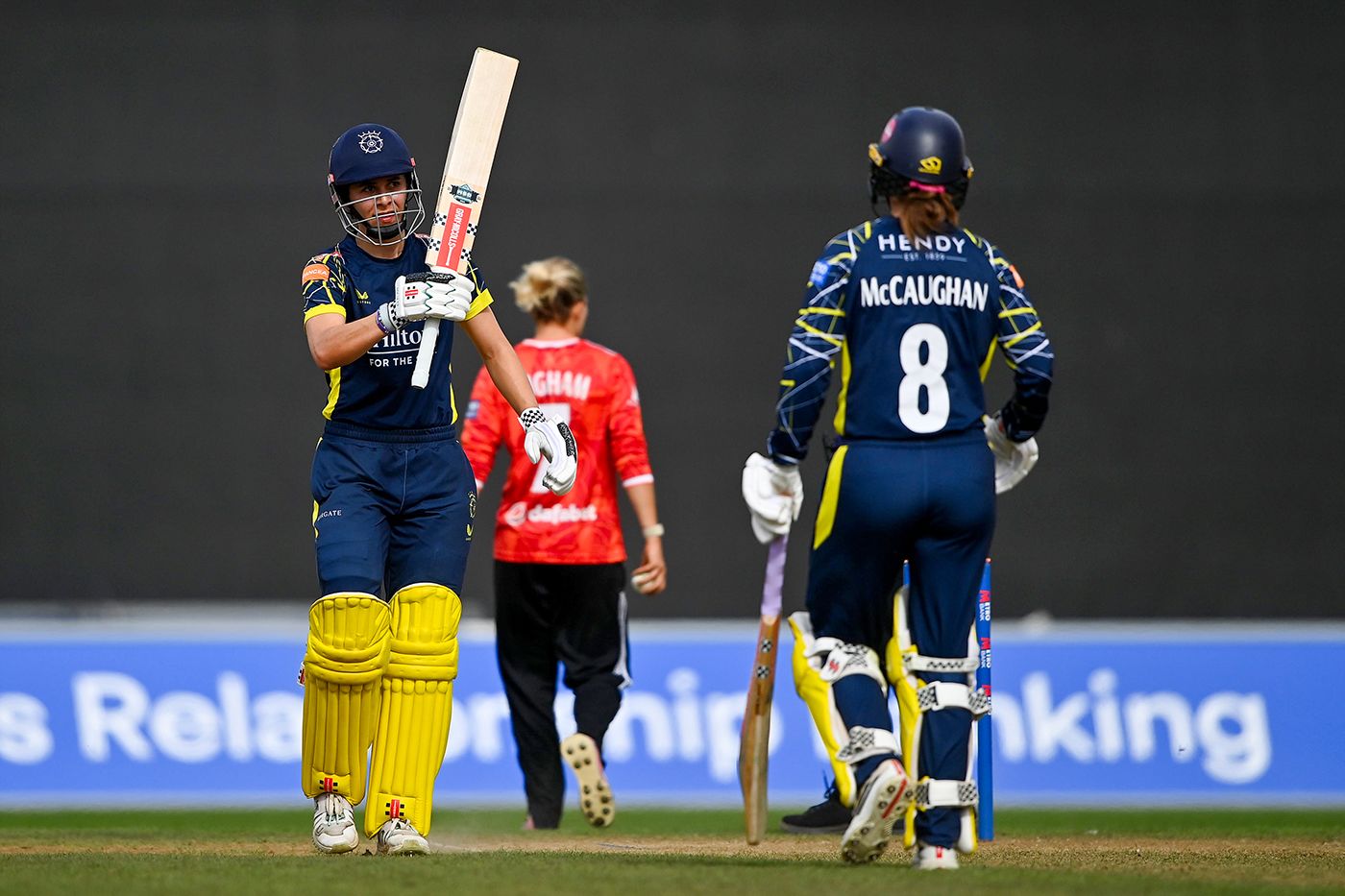 Maia Bouchier raises her bat