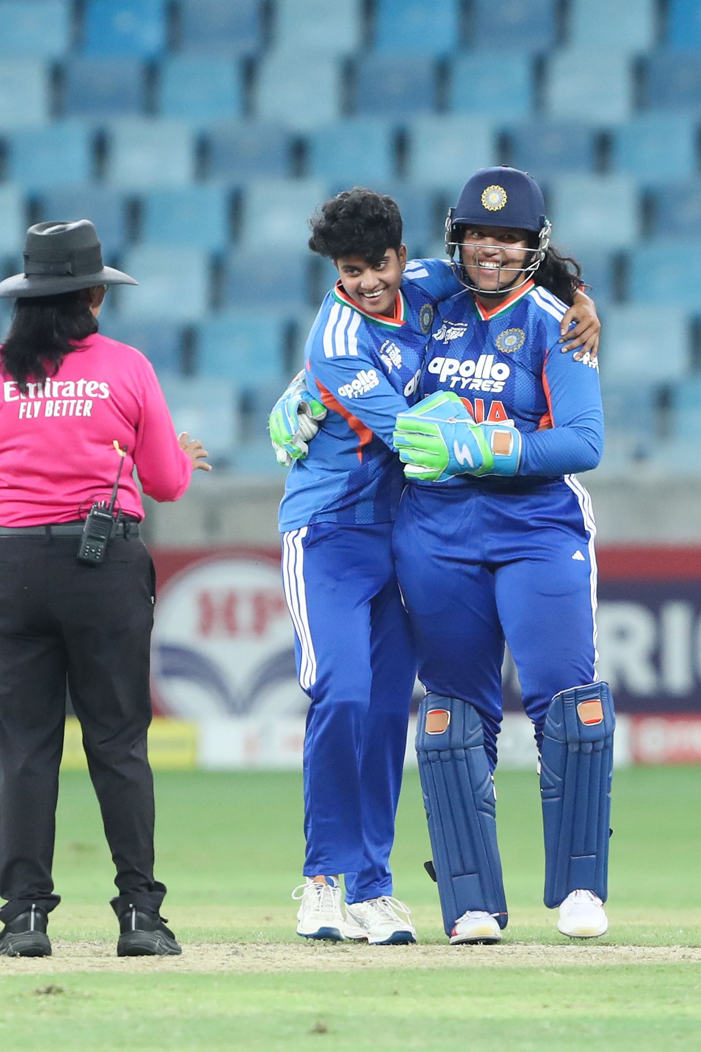 N Shree Charani and Richa Ghosh celebrate a dismissal