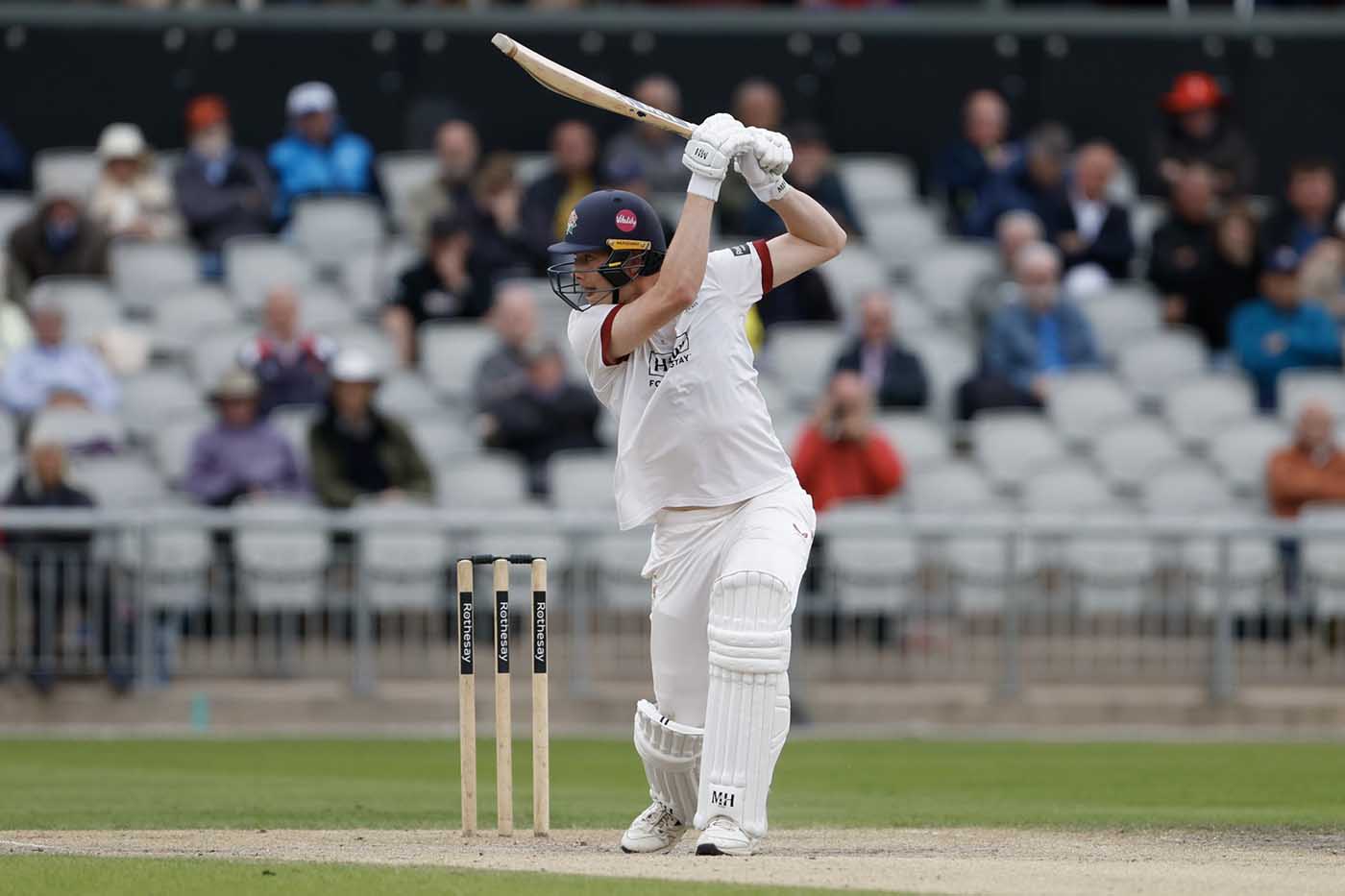 Rocky Flintoff drives one of nine boundaries in his maiden first-class fifty