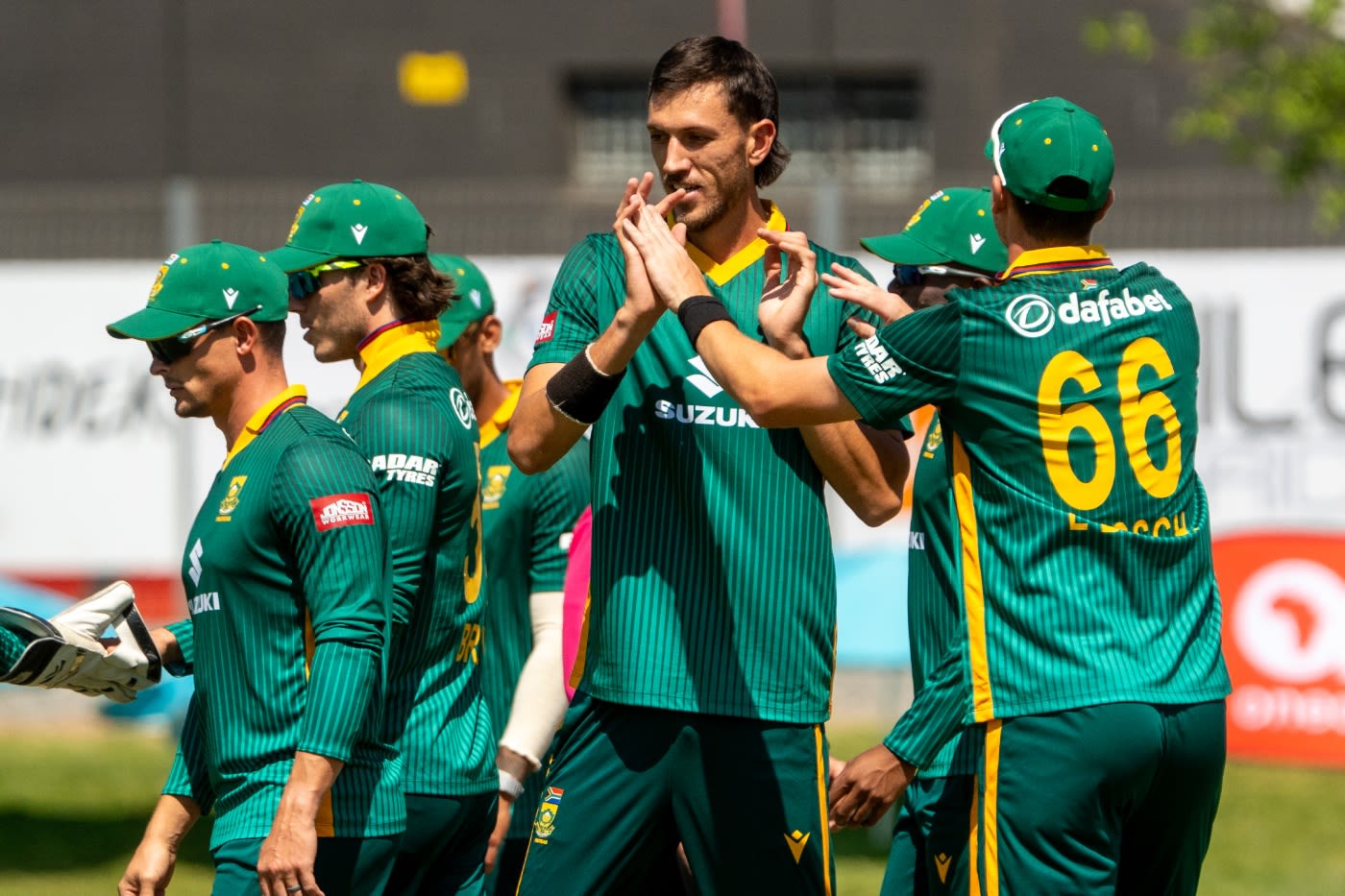 Duan Jansen celebrates a wicket with his team-mates