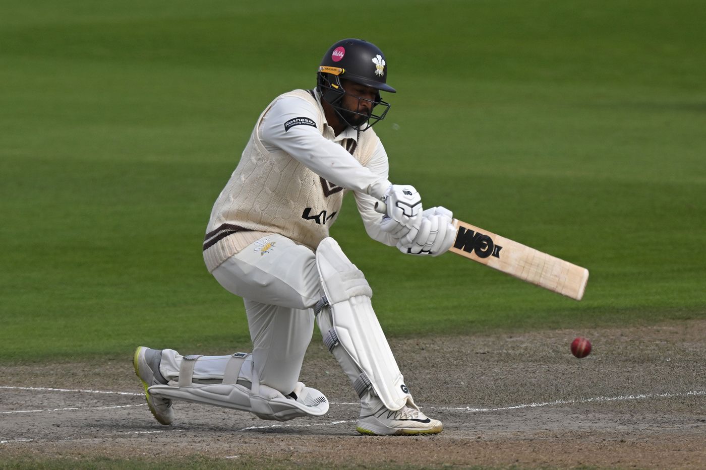 Ryan Patel sweeps during his innings of 55