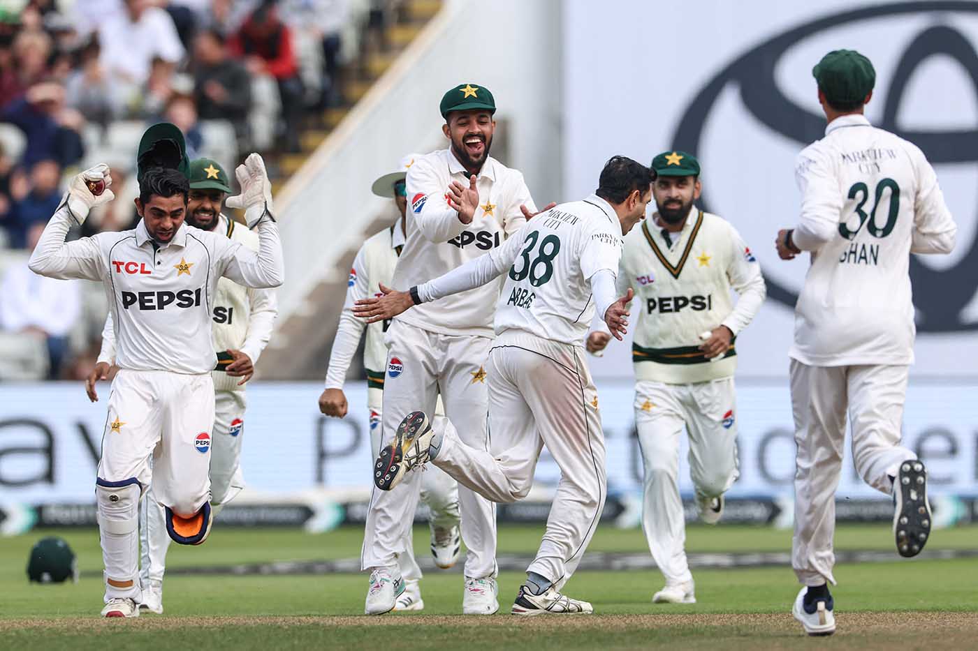 Mohammad Abbas celebrates taking the wicket Ben Duckett on the first ball of the day