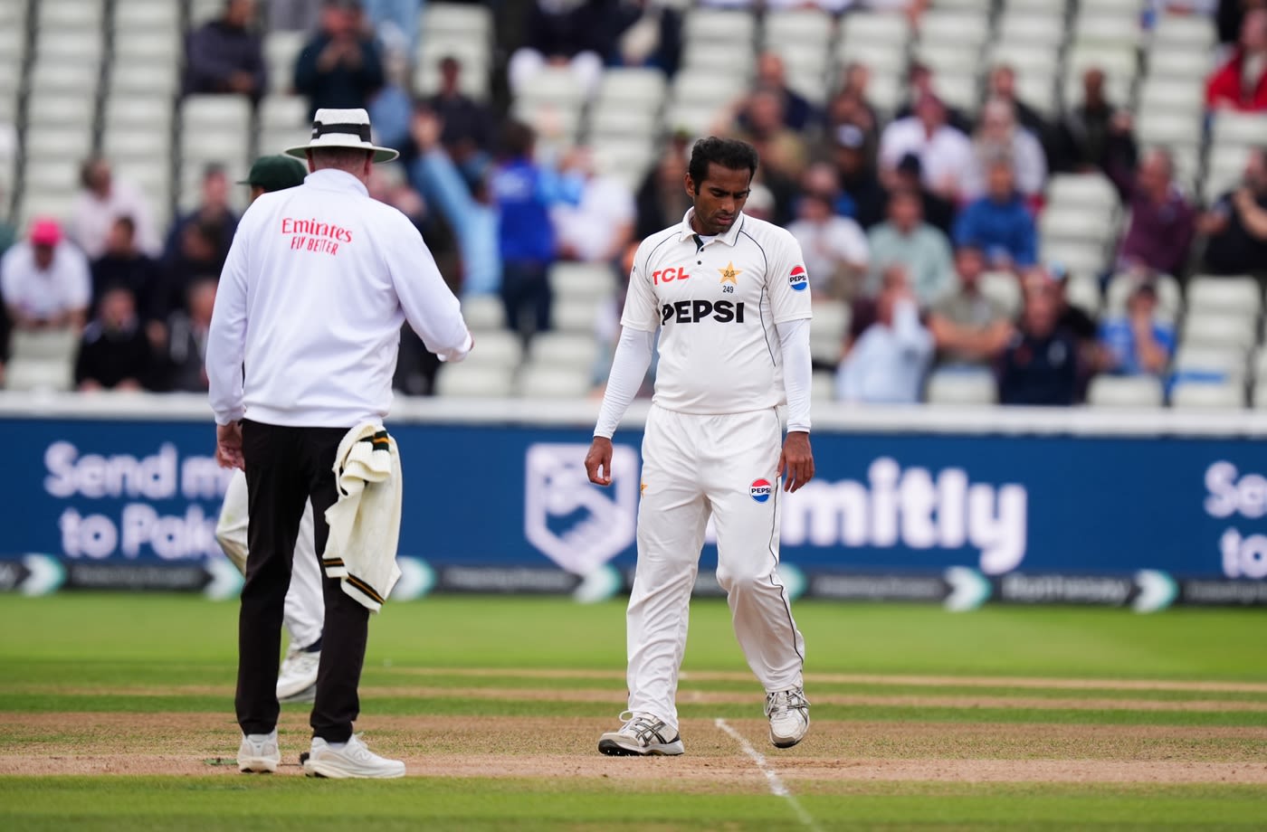 Mohammad Ali inspects the front line after a no-ball cost him the wicket of Joe Root