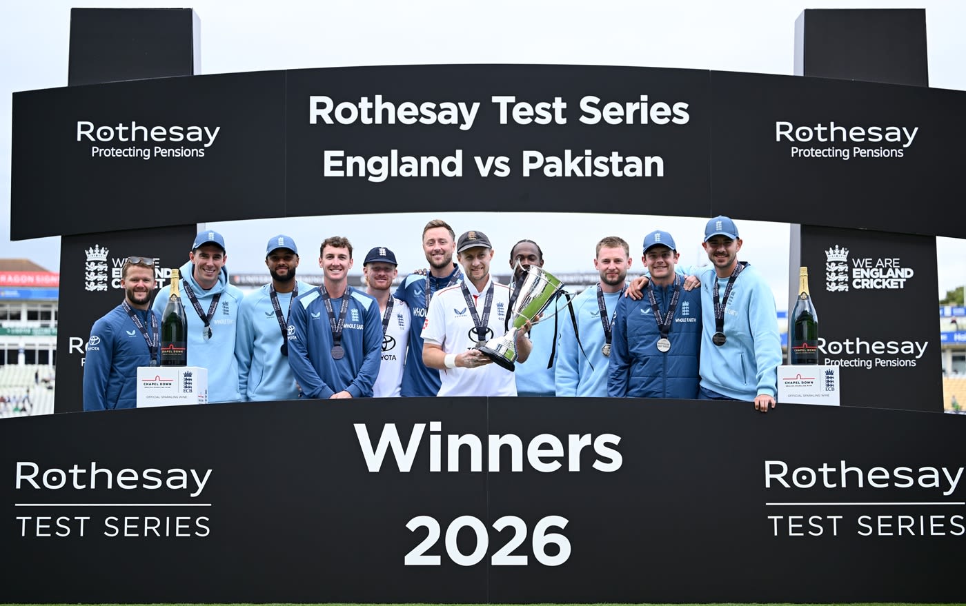 Joe Root holds up the series trophy