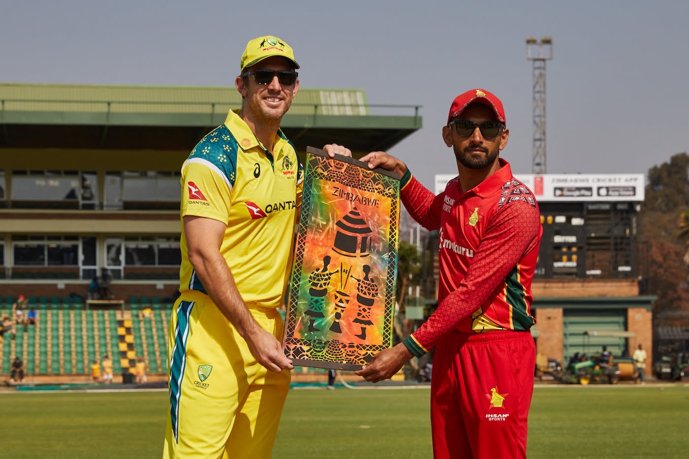 Mitchell Marsh receives a memento from Sikandar Raza