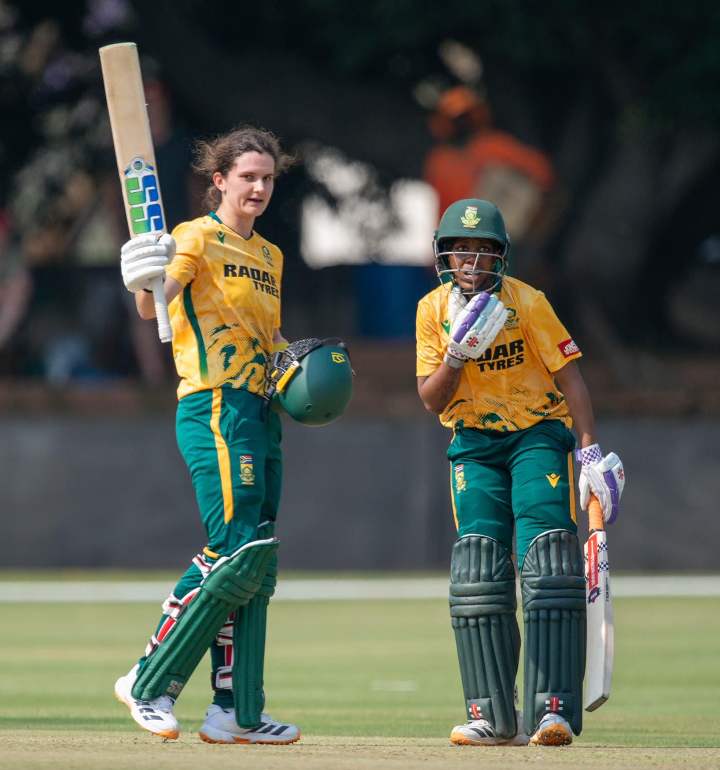 Laura Wolvaardt celebrates her fourth T20I hundred as Karabo Meso looks on