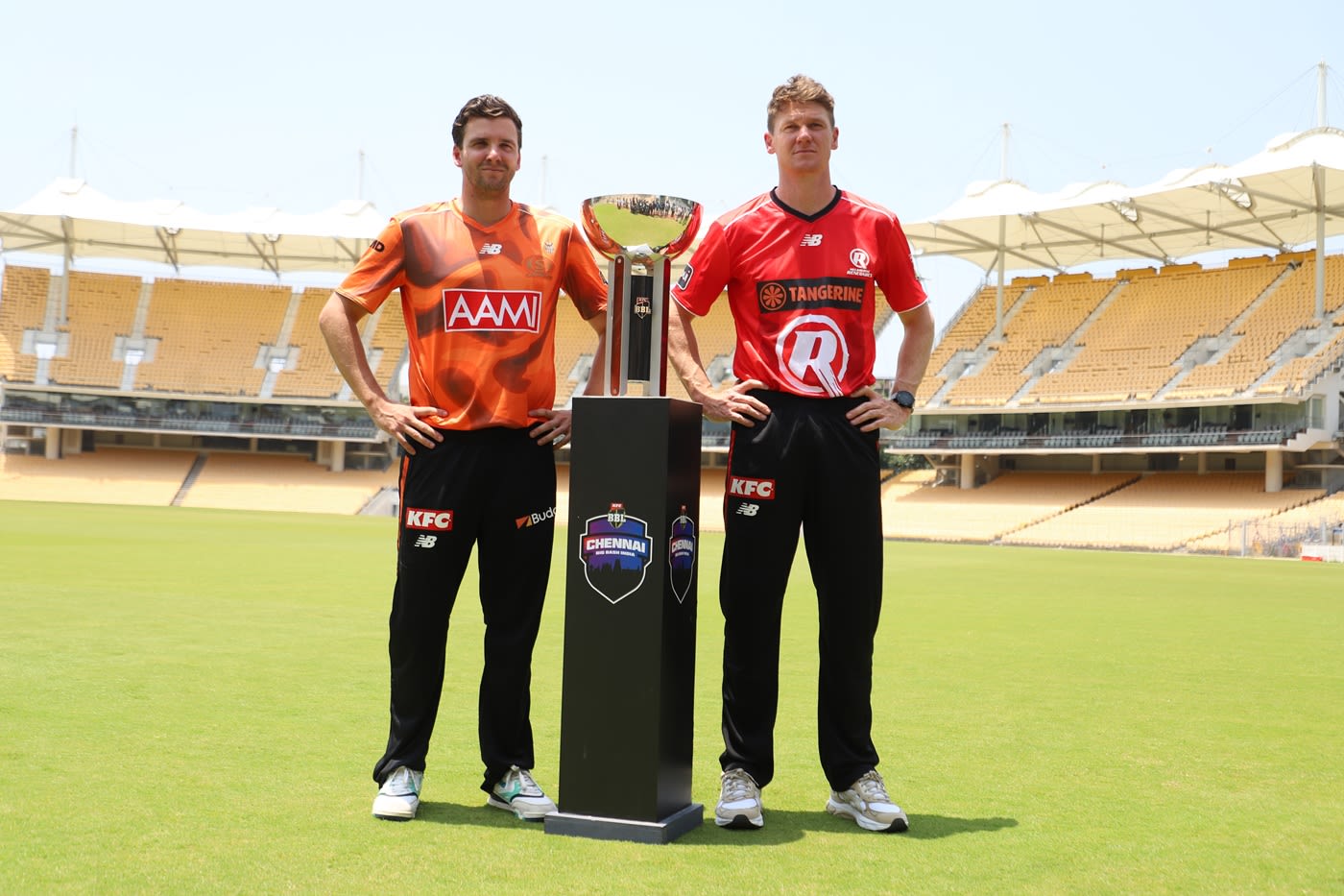 Perth Scorchers' Jhye Richardson and Melbourne Renegades' Brendan Doggett pose with the BBL trophy at Chepauk