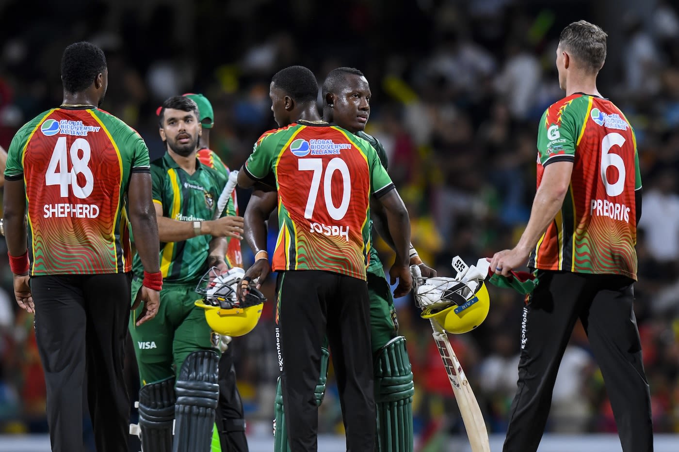 Rovman Powell is congratulated by the Amazon Warriors players