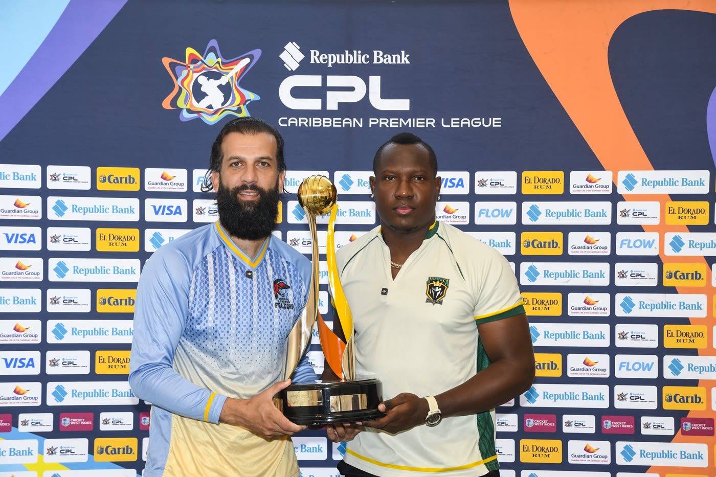 Antigua & Barbuda captain Moeen Ali and Jamaica Kingsmen captain Rovman Powell pose with the CPL trophy