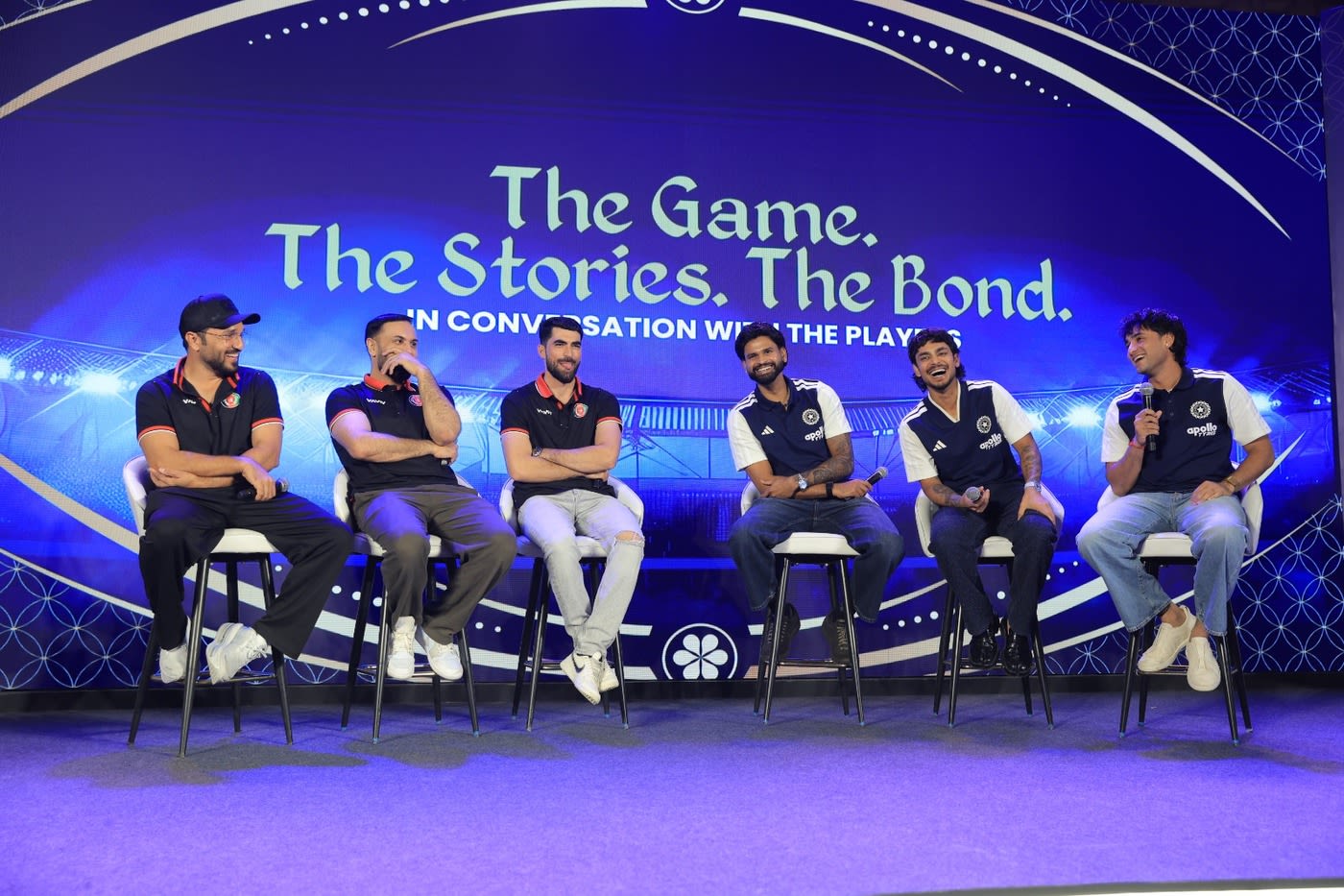 Gulbadin Naib, Mohammad Nabi and and Ibrahim Zadran share a light moment with Shreyas Iyer, Ishan Kishan and Abhishek Sharma