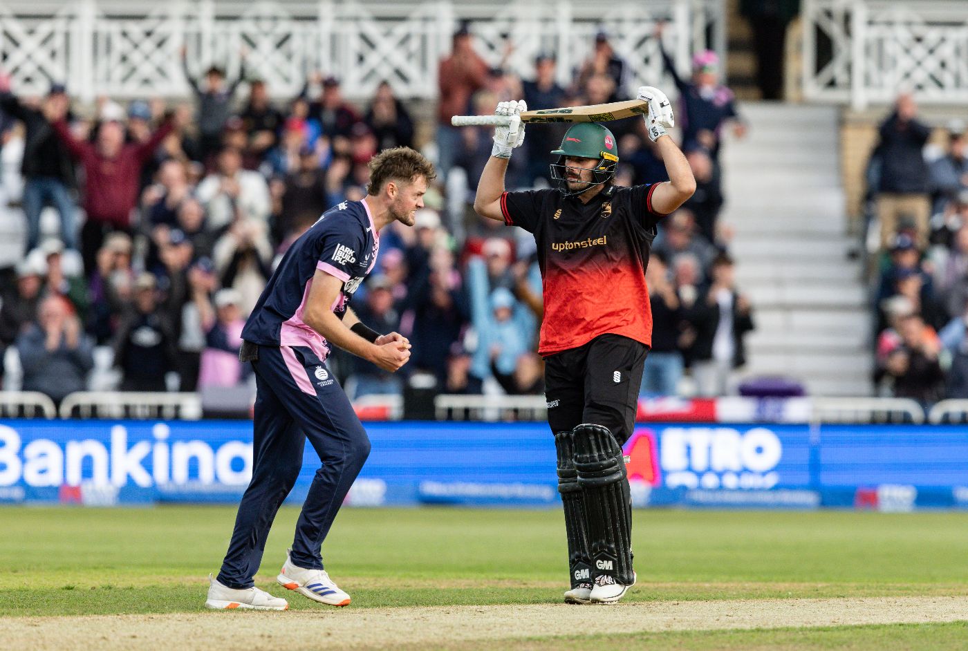 Tom Helm celebrates as Ben Green holes out