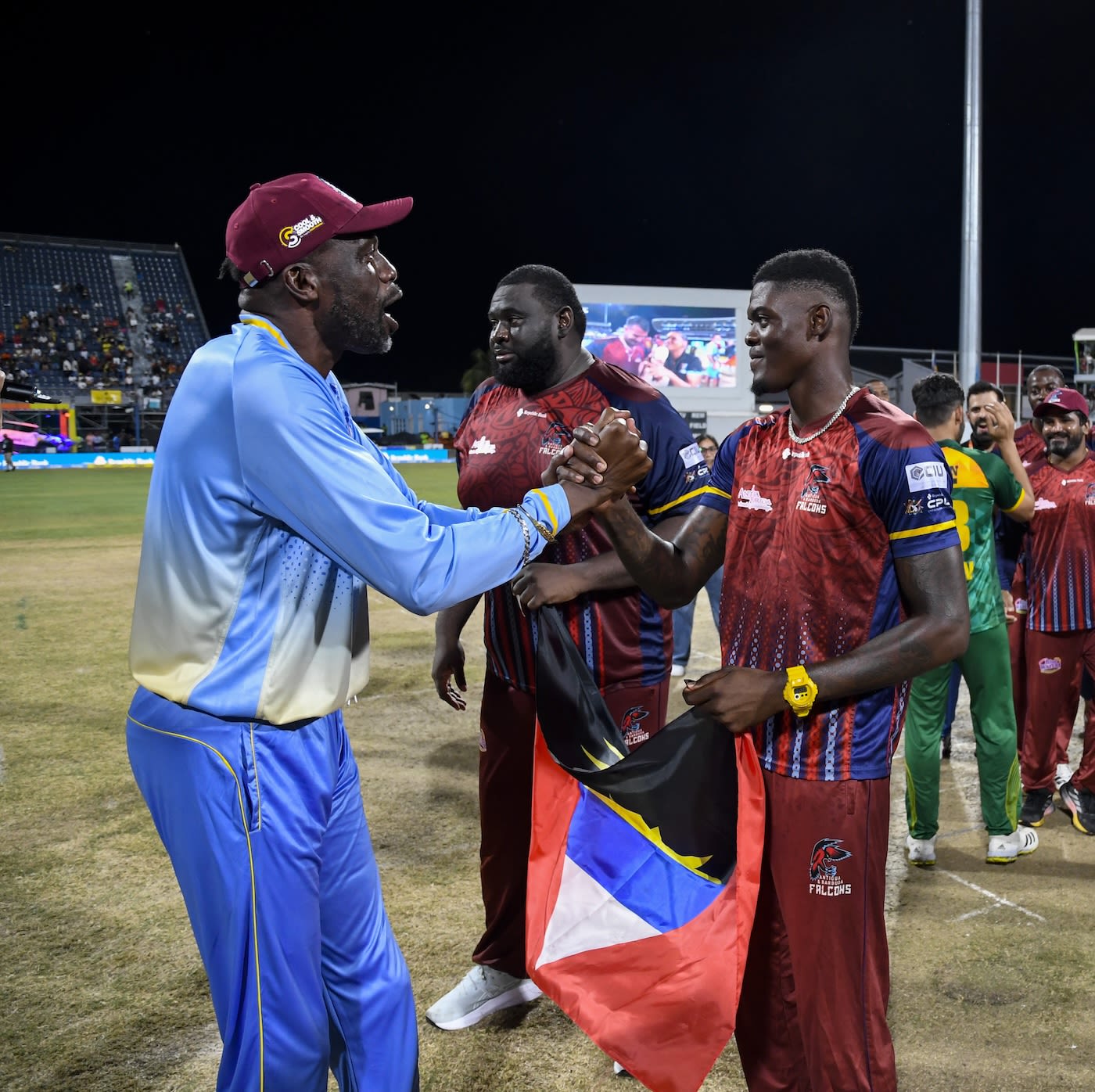 Curtly Ambrose greets Alzarri Joseph after the title win