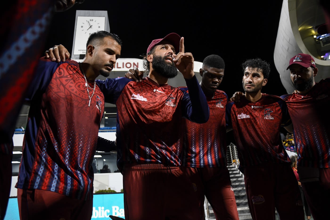 Moeen Ali speaks in the Falcons huddle