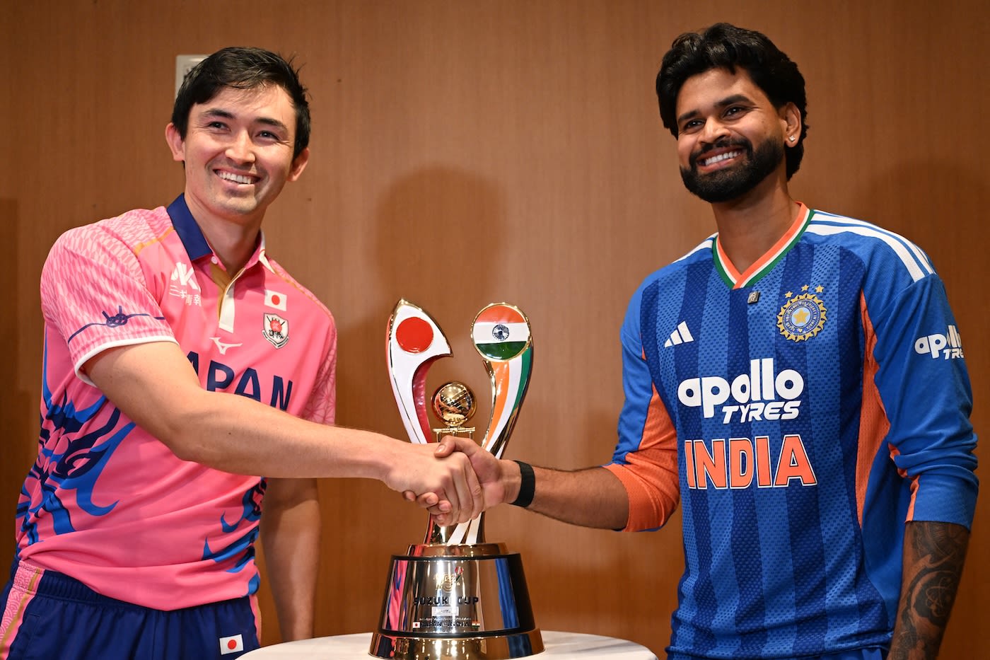 Captains Kendel Kadowaki-Fleming and Shreyas Iyer pose with the trophy