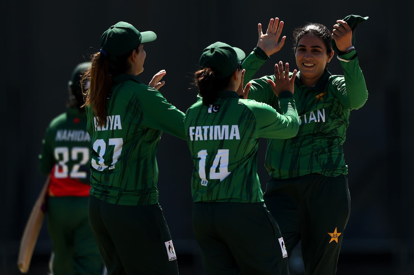 Tasmia Rubab celebrates with Fatima Sana and Aliya Riaz after Pakistan's win