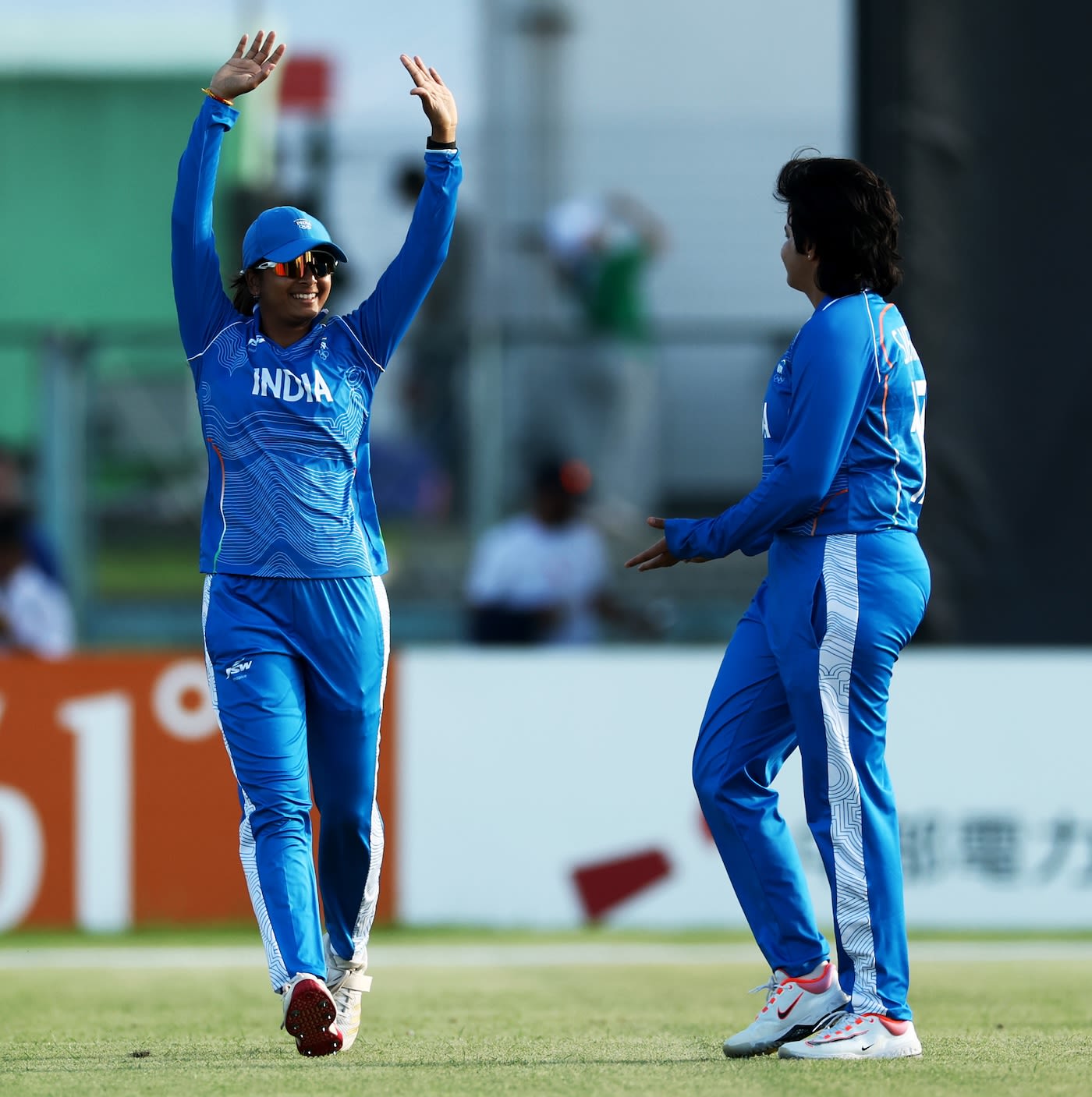Shafali Verma celebrates a wicket with Shreyanka Patil