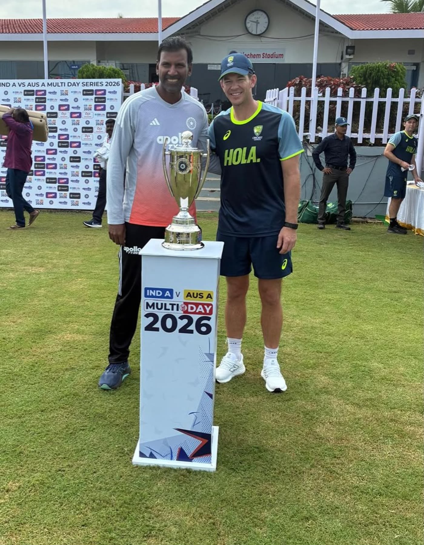 Coaches L Balaji and Tim Paine with the series trophy