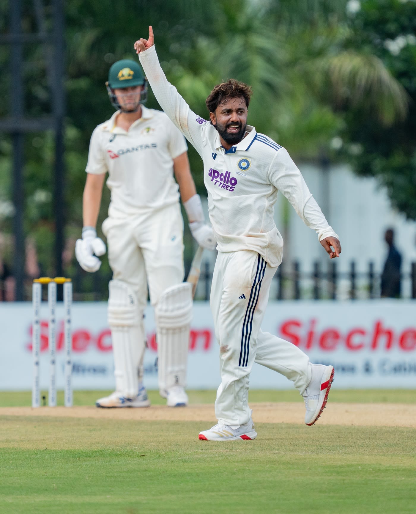 Shams Mulani wheels away after taking a wicket