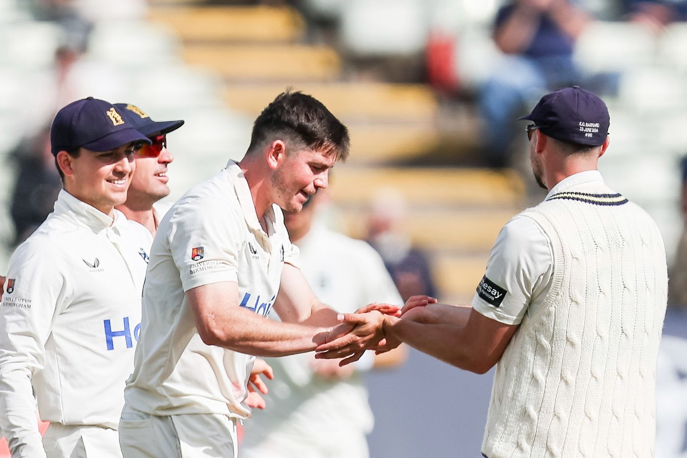 Ethan Bamber claimed four wickets as Warwickshire tightened their title grip
