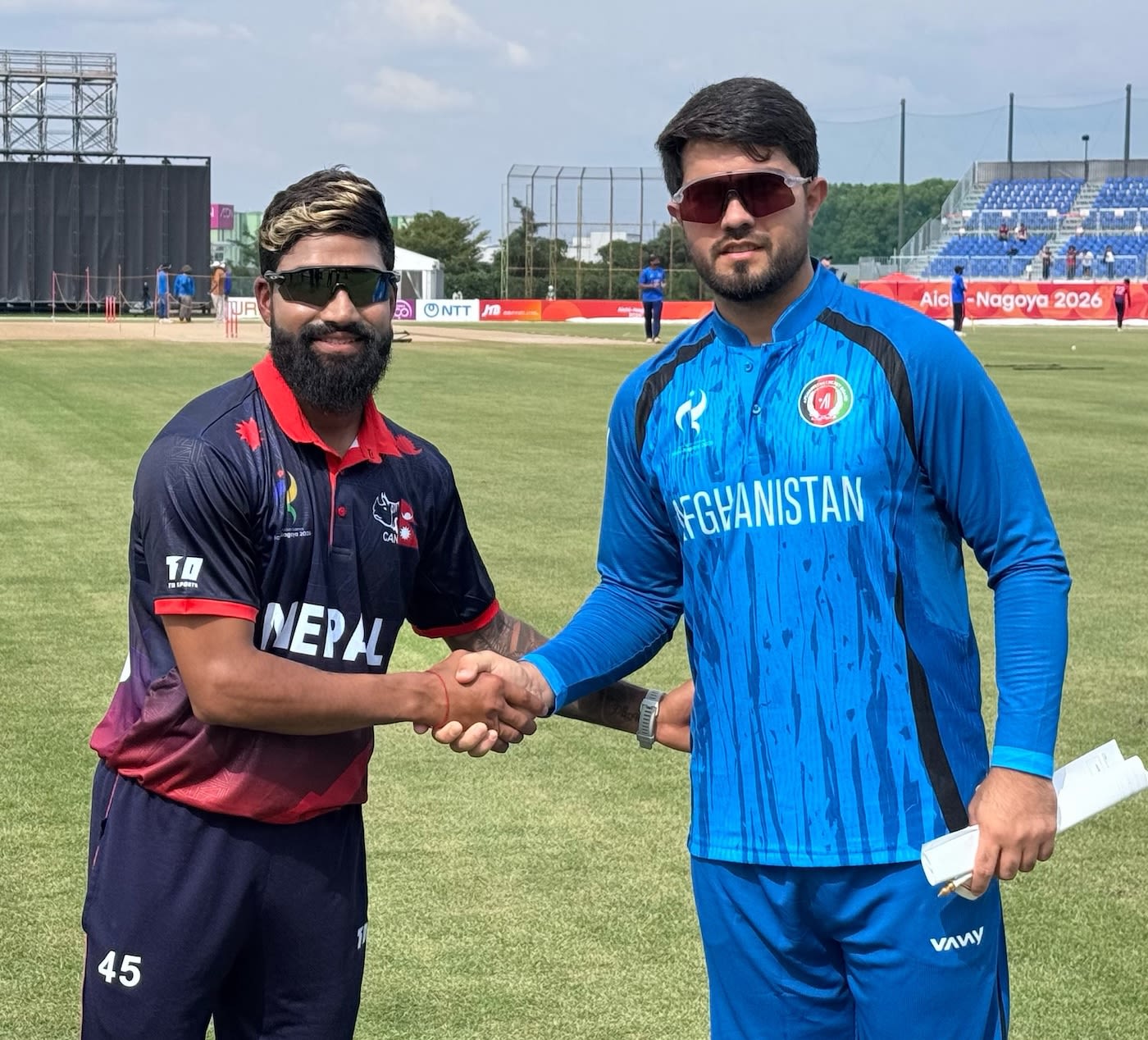 Dipendra Singh Airee and Darwish Rasooli at the toss