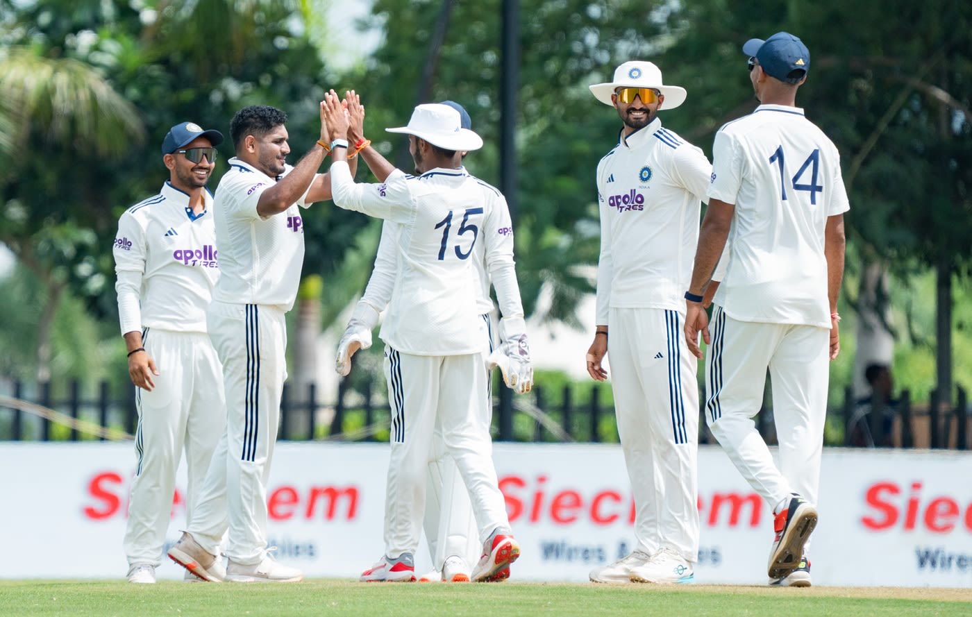 Tushar Deshpande celebrates a wicket with his team-mates