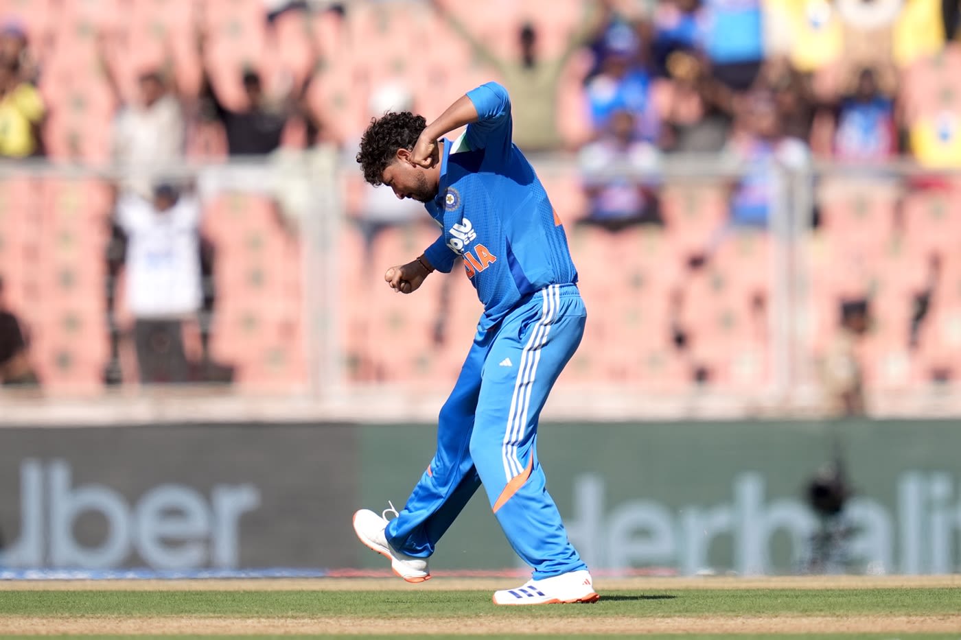 Kuldeep Yadav punches the air after dismissing John Campbell