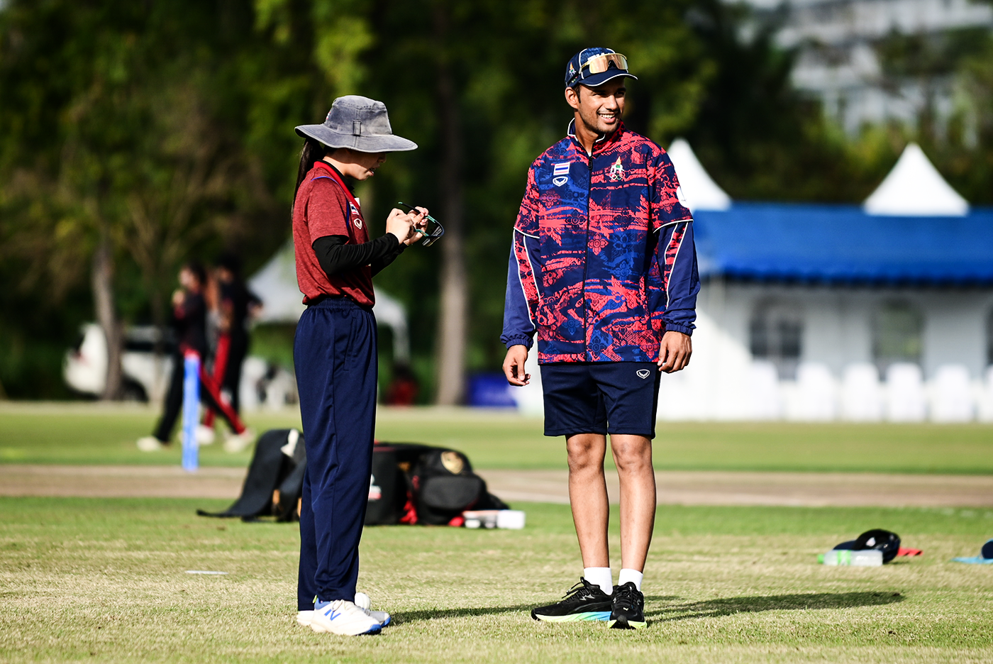 Bowler Thipatcha Putthawong talks to assistant coach Akshaykumar Yadav
