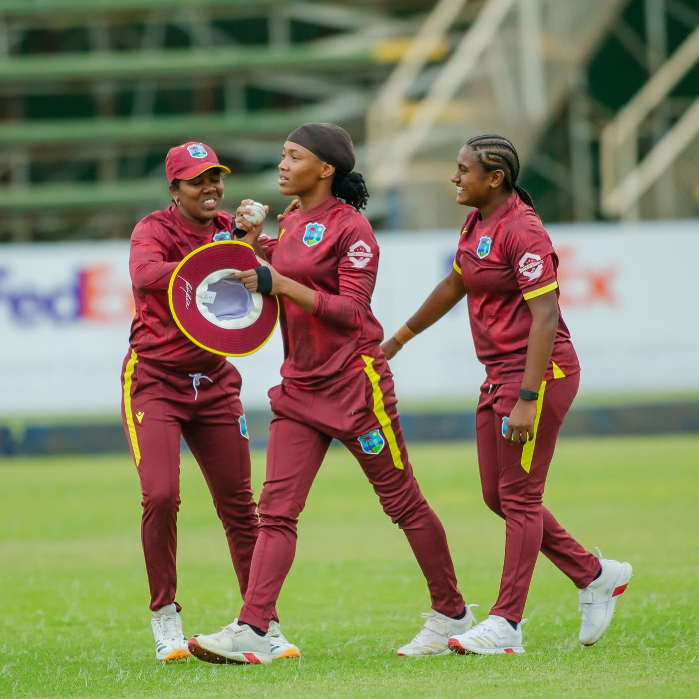 Realeanna Grimmond is congratulated by Afy Fletcher and Ashmini Munisar after taking a stunning catch
