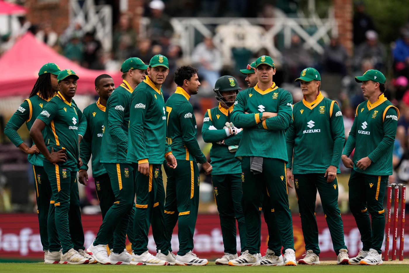 Bjorn Fortuin is mobbed by his team-mates