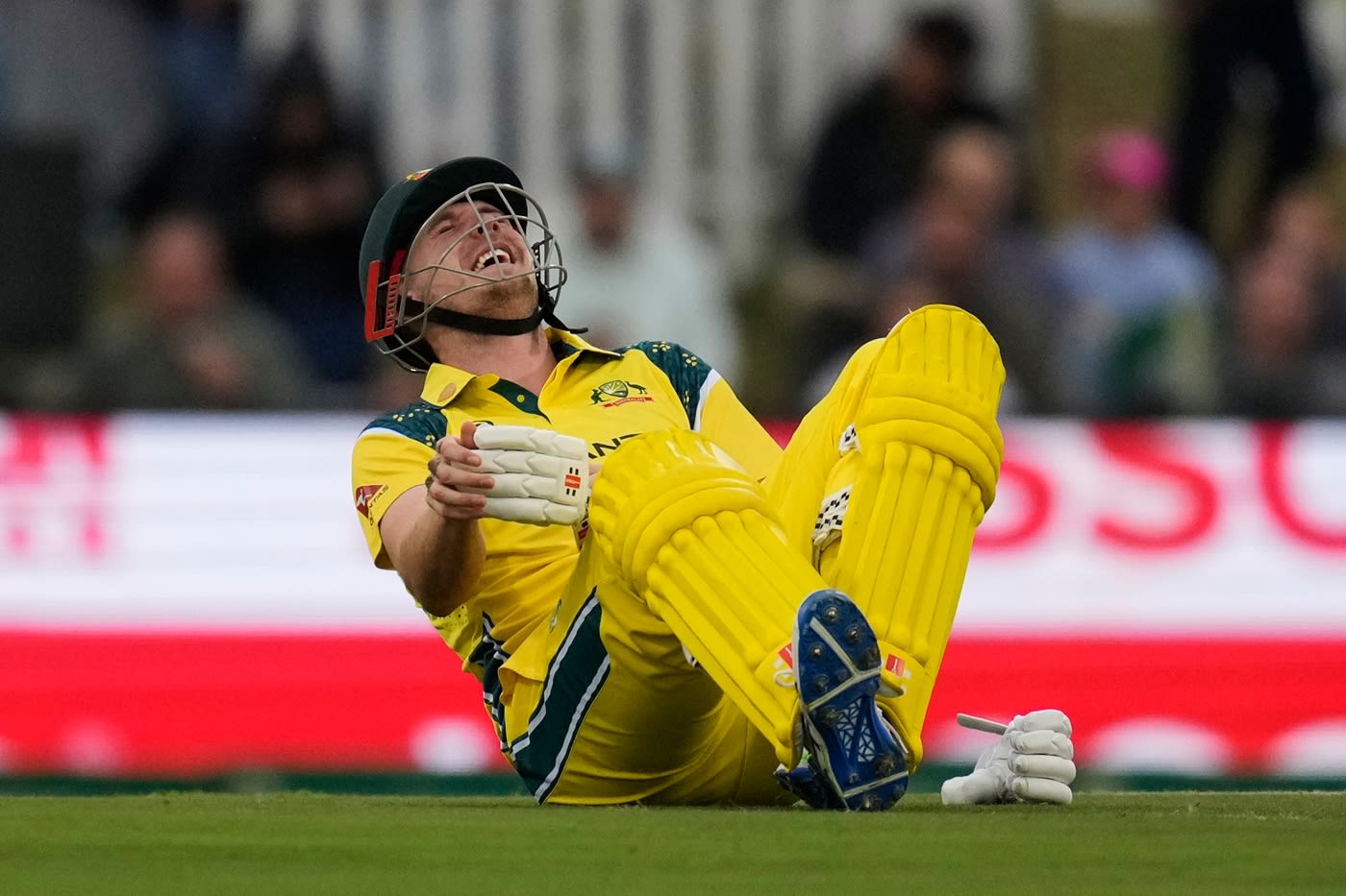 Cameron Green reacts after copping a blow while batting