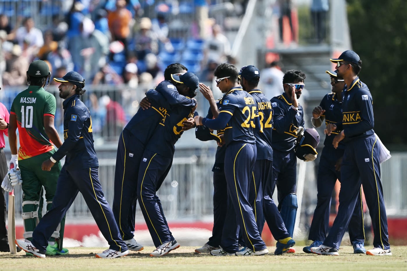 The Sri Lankans celebrate after winning the bronze medal